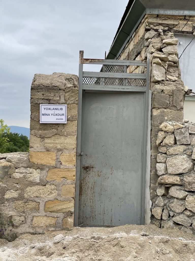 1-ruined-house-in-Shusha-sign-indicates-cleared-of-landmines1